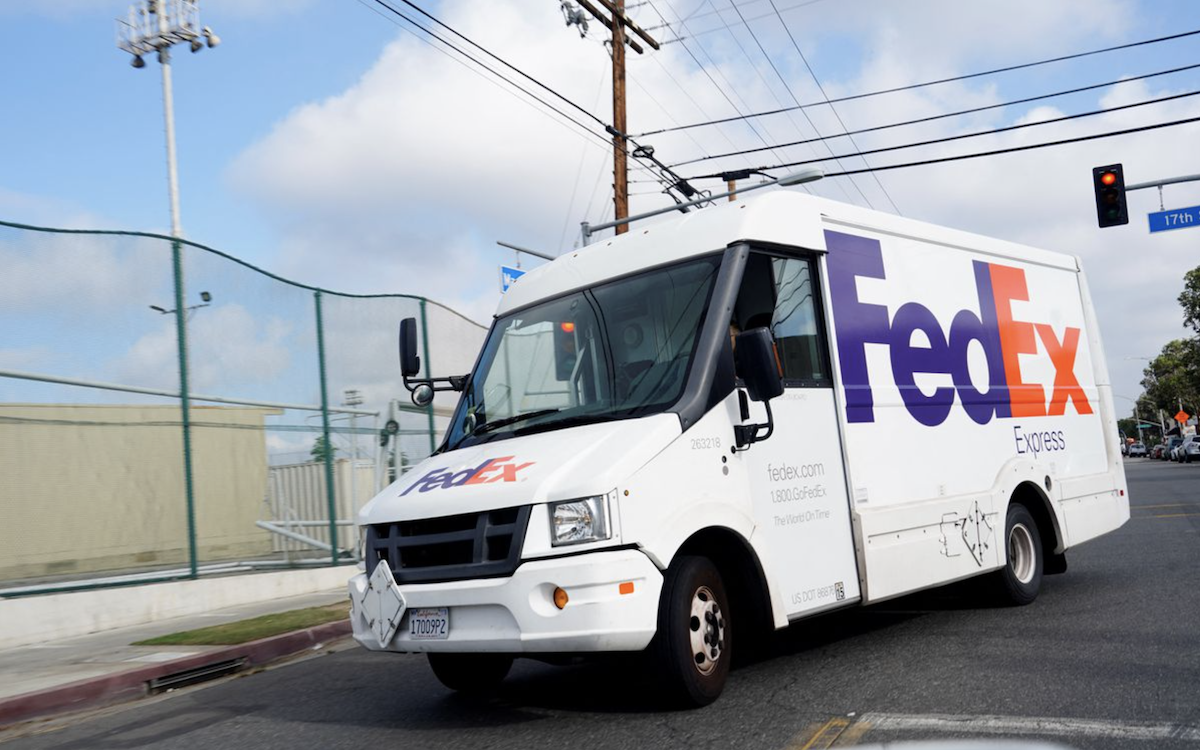 FedEx truck driving through an intersection